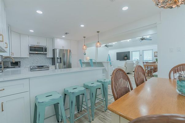 Dining room, Interior, Kitchen, Pendant Lights, Recessed Lighting, Stainless Steel Appliances, Wood Texture Flooring