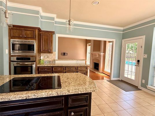Fireplace, Interior, Kitchen, Pendant Lights, Recessed Lighting, Stainless Steel Appliances, Wood Texture Flooring