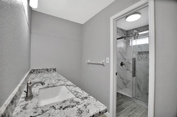 Bathroom, Glass Shower, Interior, Marble Walls, Wood Texture Flooring
