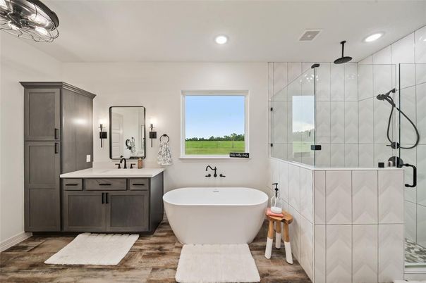 Bathroom, Dual Sink Vanities, Free Standing Baths, Glass Shower, Interior, Recessed Lighting, Wood Texture Flooring