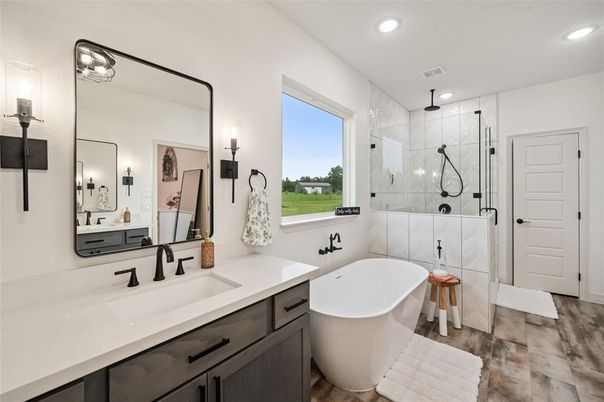 Bathroom, Dual Sink Vanities, Free Standing Baths, Glass Shower, Interior, Recessed Lighting, Wood Texture Flooring