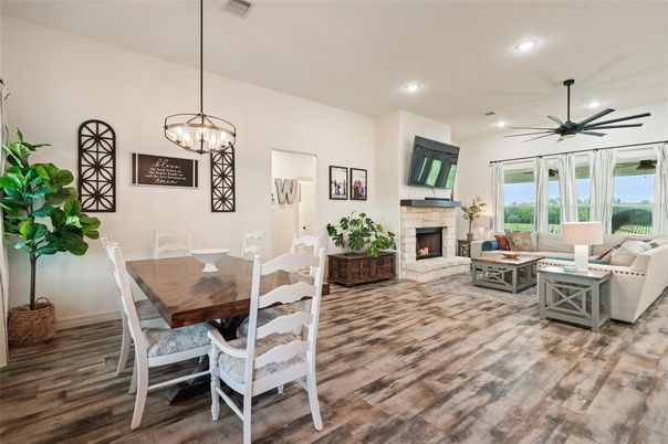 Dining room, Fireplace, Interior, Living room, Pendant Lights, Recessed Lighting, Wood Texture Flooring