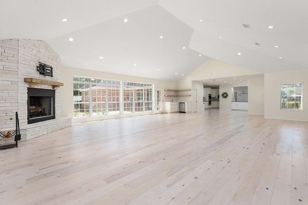 Empty room, Fireplace, Interior, Recessed Lighting, Stone Walls, Wood Texture Flooring