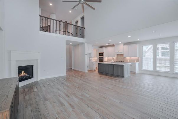 Fireplace, Interior, Kitchen, Recessed Lighting, Stainless Steel Appliances, Wood Texture Flooring