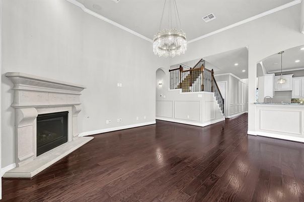 Chandelier, Empty room, Fireplace, Interior, Pendant Lights, Recessed Lighting, Wood Texture Flooring