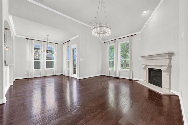 Chandelier, Empty room, Fireplace, Interior, Pendant Lights, Recessed Lighting, Wood Texture Flooring