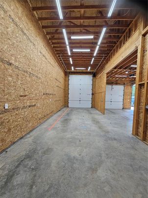 Garage, Interior, Stone Walls, Wooden Beams