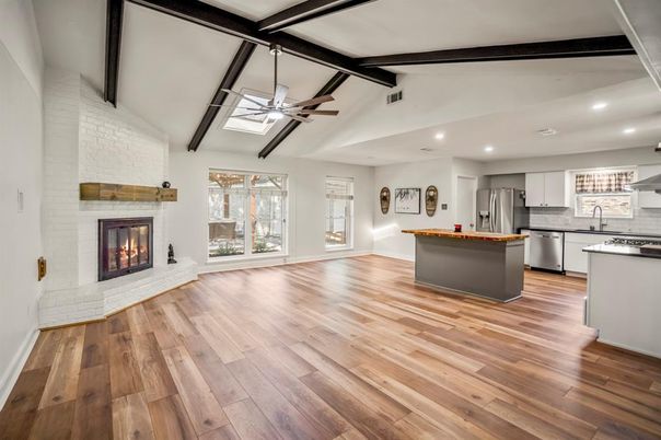 Fireplace, Interior, Kitchen, Recessed Lighting, Stainless Steel Appliances, Stone Walls, Wood Texture Flooring