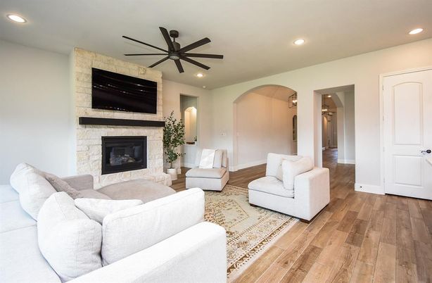 Fireplace, Interior, Living room, Recessed Lighting, Stone Walls, Wood Texture Flooring