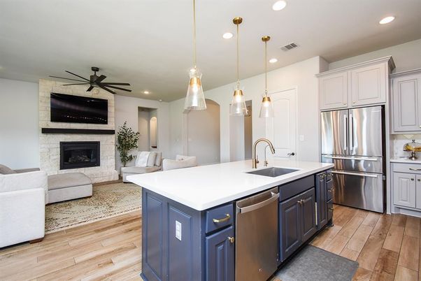Fireplace, Interior, Kitchen, Living room, Pendant Lights, Recessed Lighting, Stainless Steel Appliances, Stone Walls, Wood Texture Flooring