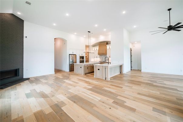 Empty room, Fireplace, Interior, Kitchen, Pendant Lights, Recessed Lighting, Wood Texture Flooring