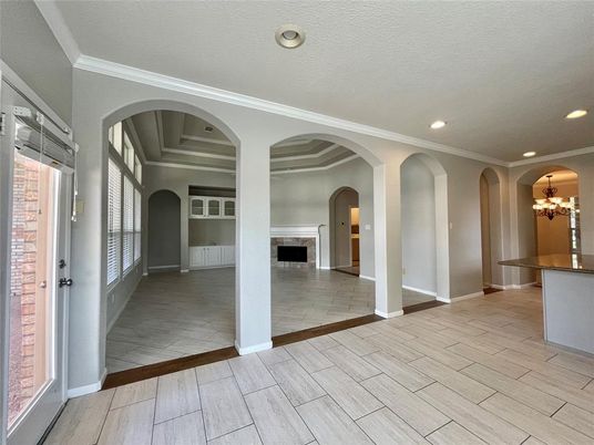 Chandelier, Empty room, Fireplace, Interior, Recessed Lighting, Wood Texture Flooring