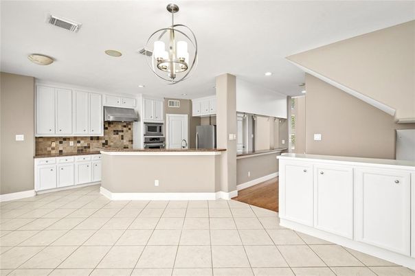 Chandelier, Interior, Kitchen, Pendant Lights, Recessed Lighting, Stainless Steel Appliances, Wood Texture Flooring