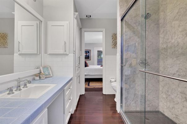 Bathroom, Bedroom, Glass Shower, Interior, Tile Countertops, Wood Texture Flooring