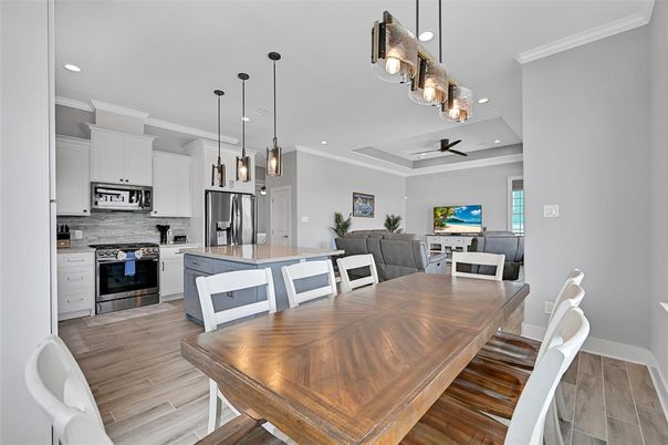 Dining room, Interior, Kitchen, Pendant Lights, Recessed Lighting, Stainless Steel Appliances, Wood Texture Flooring