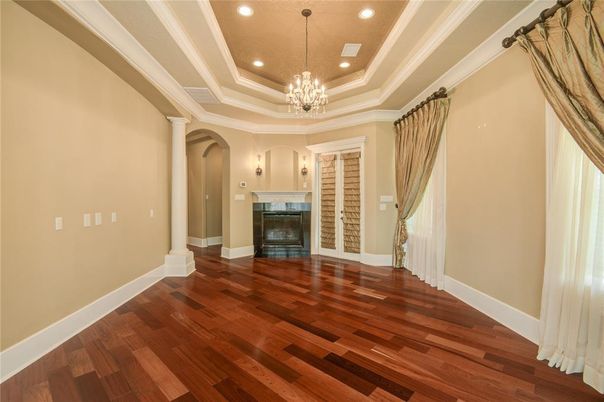 Chandelier, Empty room, Fireplace, Interior, Recessed Lighting, Wood Texture Flooring