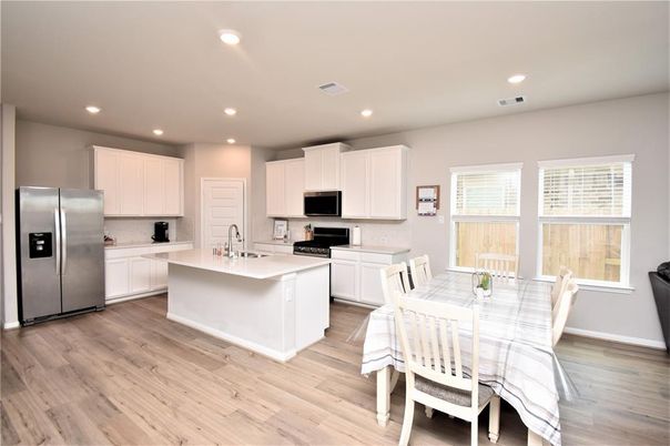 Dining room, Interior, Kitchen, Recessed Lighting, Stainless Steel Appliances, Wood Texture Flooring