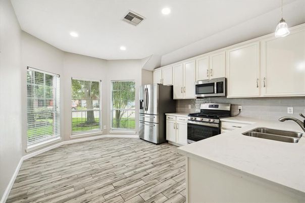 Interior, Kitchen, Pendant Lights, Recessed Lighting, Stainless Steel Appliances, Wood Texture Flooring