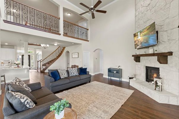 Fireplace, Interior, Living room, Recessed Lighting, Stone Walls, Wood Texture Flooring