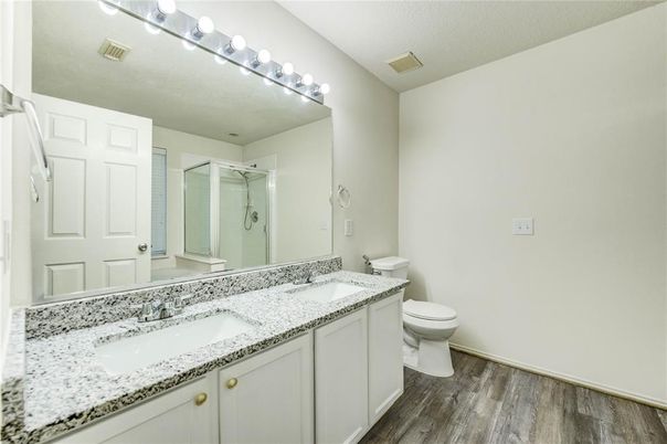 Bathroom, Dual Sink Vanities, Glass Shower, Interior, Wood Texture Flooring