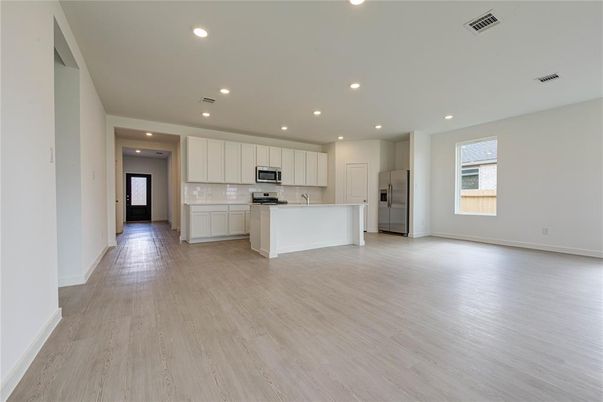 Empty room, Interior, Kitchen, Recessed Lighting, Stainless Steel Appliances, Wood Texture Flooring