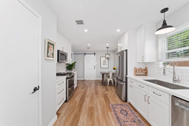 Dining room, Interior, Kitchen, Pendant Lights, Recessed Lighting, Stainless Steel Appliances, Wood Texture Flooring