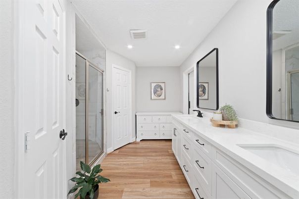 Bathroom, Dual Sink Vanities, Glass Shower, Interior, Recessed Lighting, Wood Texture Flooring