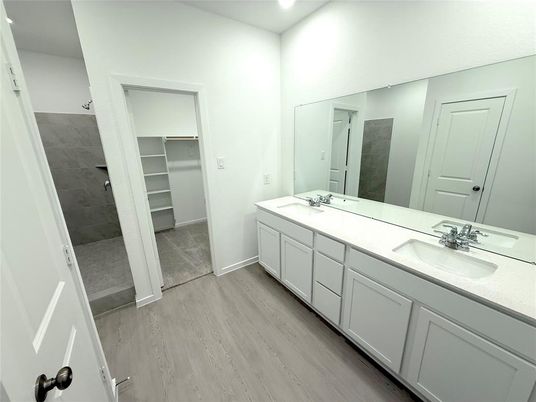 Bathroom, Dual Sink Vanities, Interior, Recessed Lighting, Walk-in Closets, Wood Texture Flooring