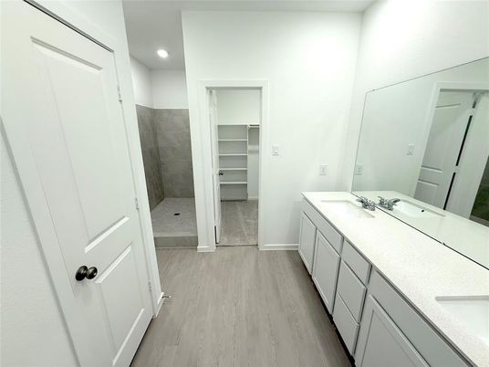 Bathroom, Dual Sink Vanities, Interior, Recessed Lighting, Walk-in Closets, Wood Texture Flooring
