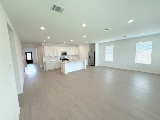 Empty room, Interior, Kitchen, Recessed Lighting, Stainless Steel Appliances, Wood Texture Flooring