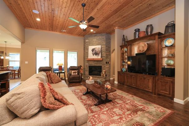 Dining room, Fireplace, Interior, Living room, Recessed Lighting, Stone Walls, Wooden Ceilings, Wood Texture Flooring