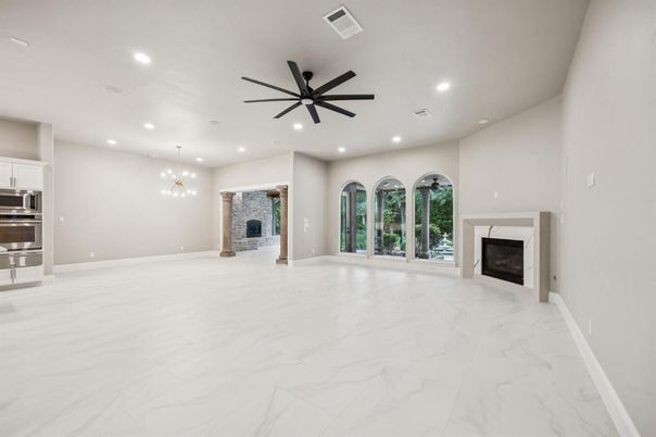 Empty room, Fireplace, Interior, Kitchen, Marble, Pendant Lights, Recessed Lighting, Stainless Steel Appliances, Stone Walls