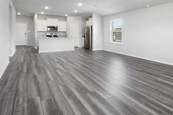 Empty room, Interior, Kitchen, Recessed Lighting, Stainless Steel Appliances, Wood Texture Flooring