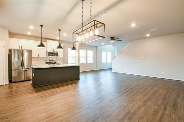 Empty room, Interior, Kitchen, Pendant Lights, Recessed Lighting, Stainless Steel Appliances, Wood Texture Flooring