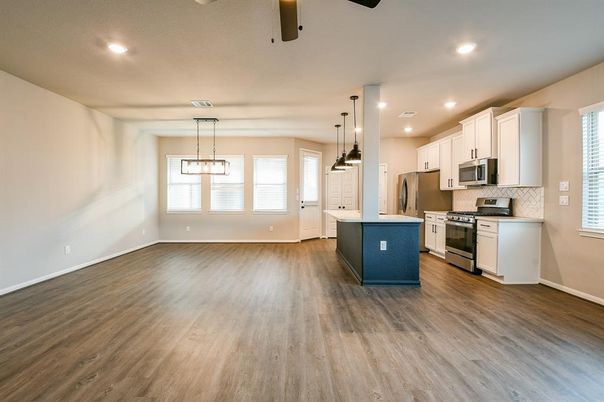 Empty room, Interior, Kitchen, Pendant Lights, Recessed Lighting, Stainless Steel Appliances, Wood Texture Flooring