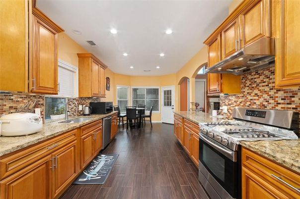Dining room, Interior, Kitchen, Recessed Lighting, Stainless Steel Appliances, Wood Texture Flooring