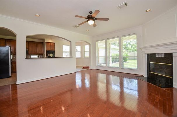 Empty room, Fireplace, Interior, Kitchen, Recessed Lighting, Wood Texture Flooring