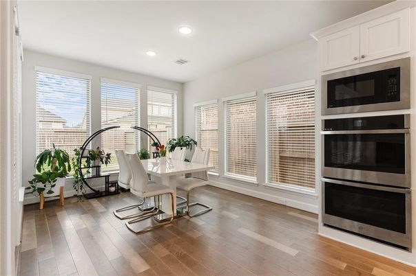 Dining room, Interior, Recessed Lighting, Stainless Steel Appliances, Wood Texture Flooring