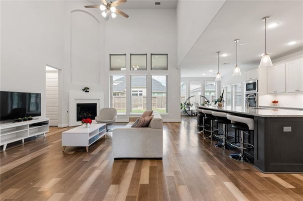 Fireplace, Interior, Kitchen, Living room, Pendant Lights, Recessed Lighting, Stainless Steel Appliances, Wood Texture Flooring