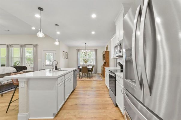 Chandelier, Dining room, Interior, Kitchen, Pendant Lights, Recessed Lighting, Stainless Steel Appliances, Wood Texture Flooring