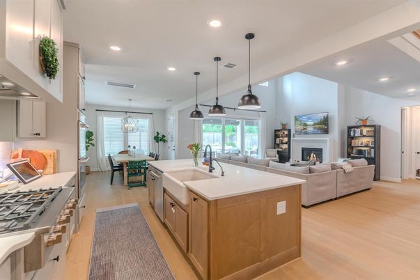 Chandelier, Dining room, Fireplace, Interior, Kitchen, Living room, Pendant Lights, Recessed Lighting, Wood Texture Flooring