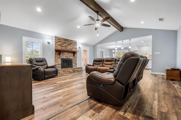 Fireplace, Interior, Living room, Pendant Lights, Recessed Lighting, Stone Walls, Wood Texture Flooring