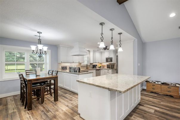 Chandelier, Dining room, Interior, Kitchen, Pendant Lights, Recessed Lighting, Stainless Steel Appliances, Wood Texture Flooring
