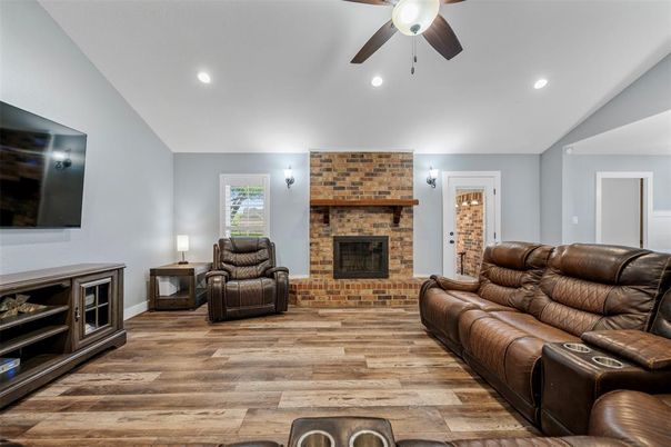 Fireplace, Interior, Living room, Recessed Lighting, Stone Walls, Wood Texture Flooring