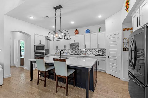 Chandelier, Interior, Kitchen, Pendant Lights, Recessed Lighting, Stainless Steel Appliances, Wood Texture Flooring