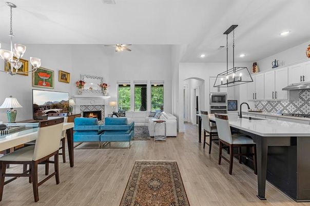 Chandelier, Dining room, Fireplace, Interior, Kitchen, Living room, Pendant Lights, Recessed Lighting, Wood Texture Flooring