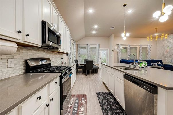 Dining room, Interior, Kitchen, Pendant Lights, Recessed Lighting, Stainless Steel Appliances, Wood Texture Flooring