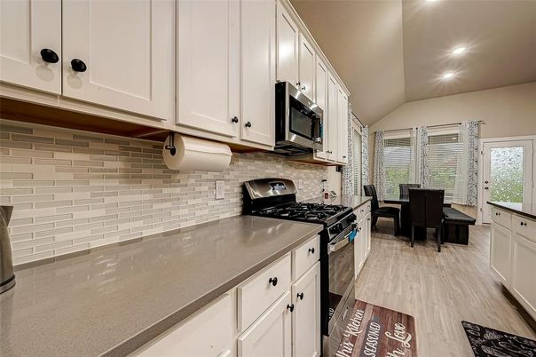 Dining room, Interior, Kitchen, Recessed Lighting, Stainless Steel Appliances, Wood Texture Flooring