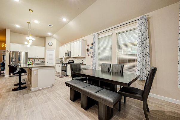 Dining room, Interior, Kitchen, Pendant Lights, Recessed Lighting, Stainless Steel Appliances, Wood Texture Flooring