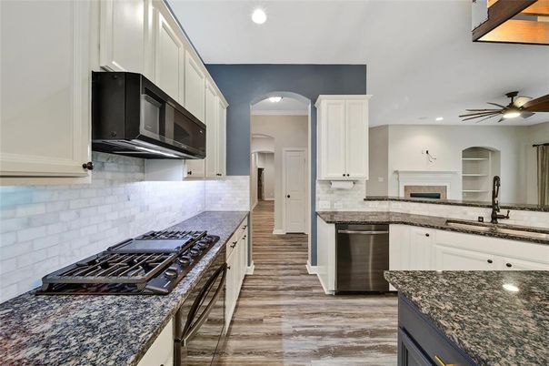Fireplace, Interior, Kitchen, Recessed Lighting, Stainless Steel Appliances, Wood Texture Flooring